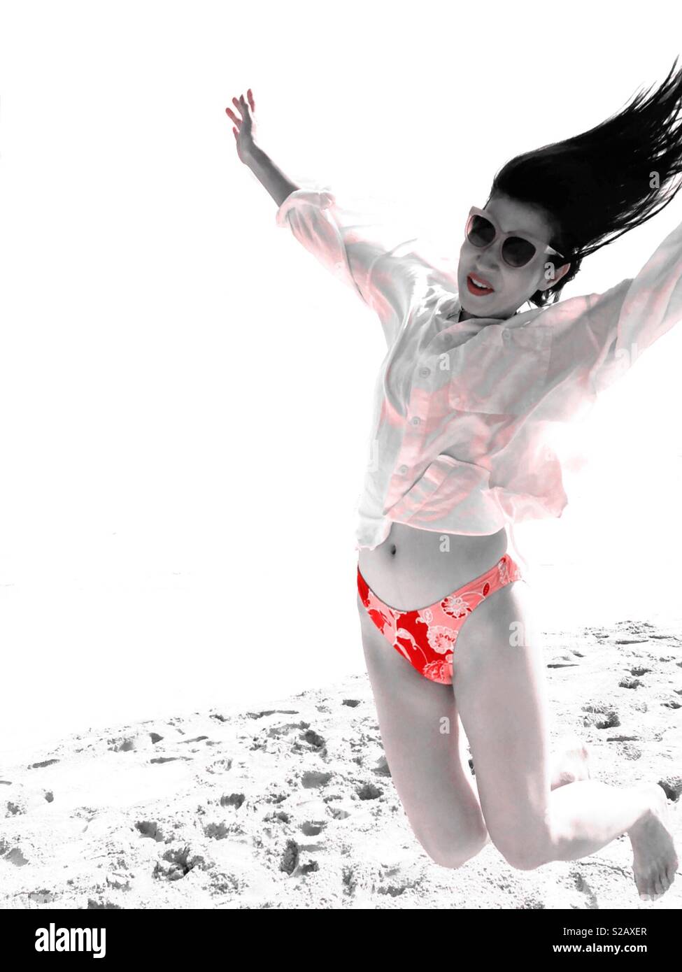 Moon jump falling in zero gravity onto earth beach dream state altered mind reality hallucinating acid lsd crazy rich Asian - Smartphone Captured Stock Image