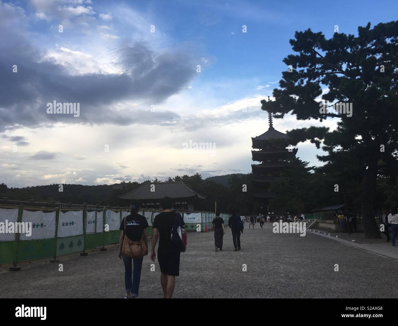 People walking towards a temple - Smartphone Captured Stock Image