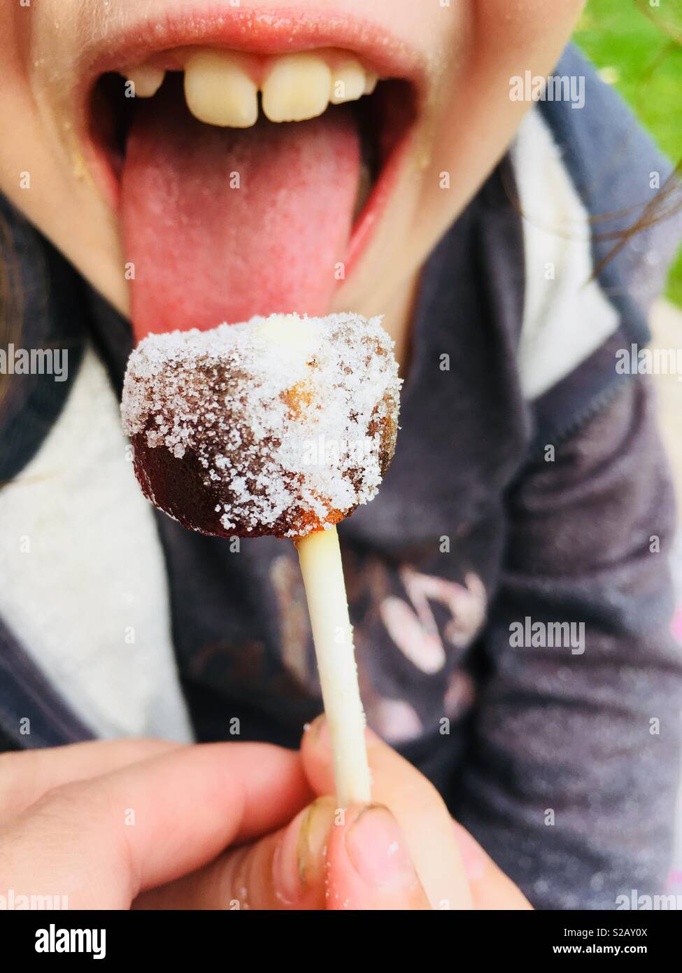 Eating a lollipop Stock Photo Alamy