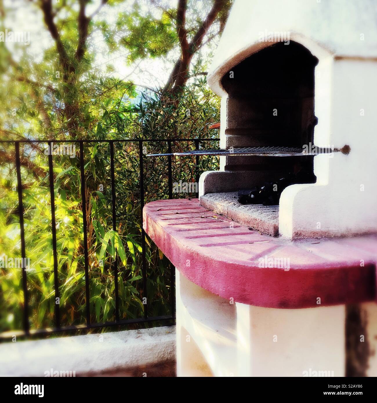 Barbecue made of concrete in a garden in Spain - Smartphone Captured Stock Image