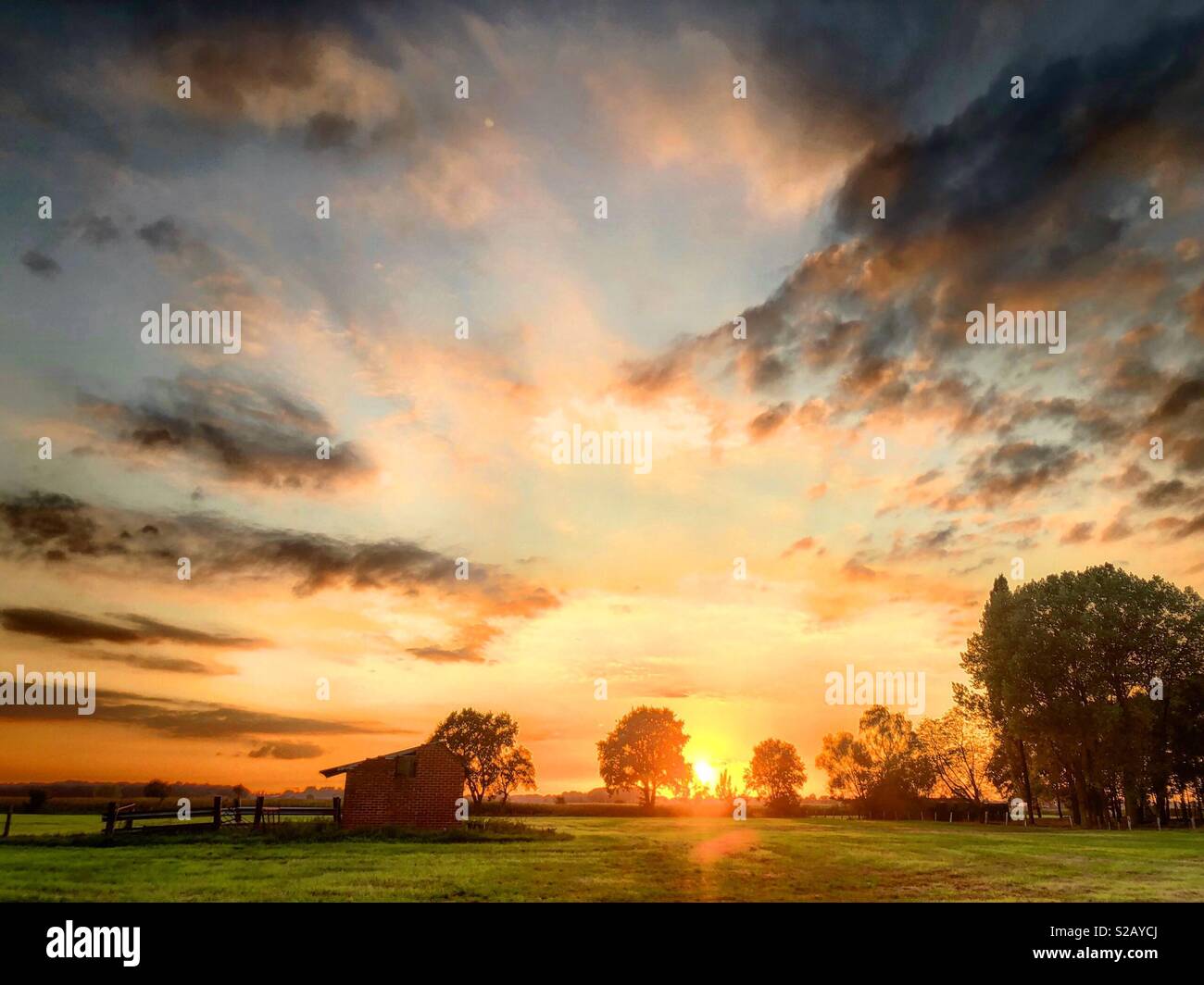 Idyllic and colorful Countryside sunrise landscape Stock Photo - Alamy