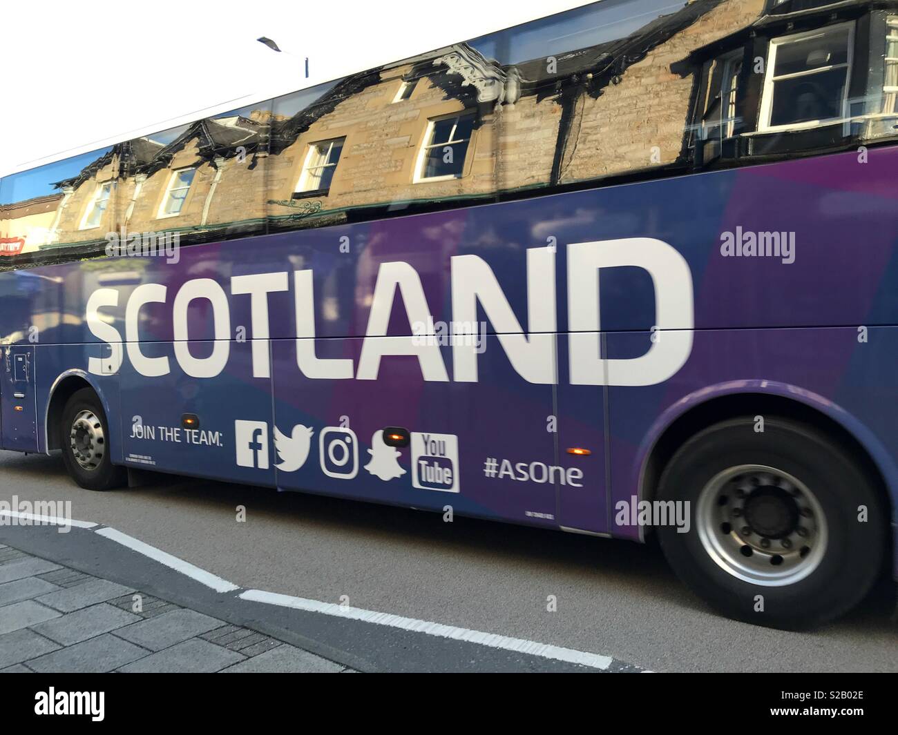 Coach, with reflection of buildings, Pitlochry, Scotland - Smartphone Captured Stock Image
