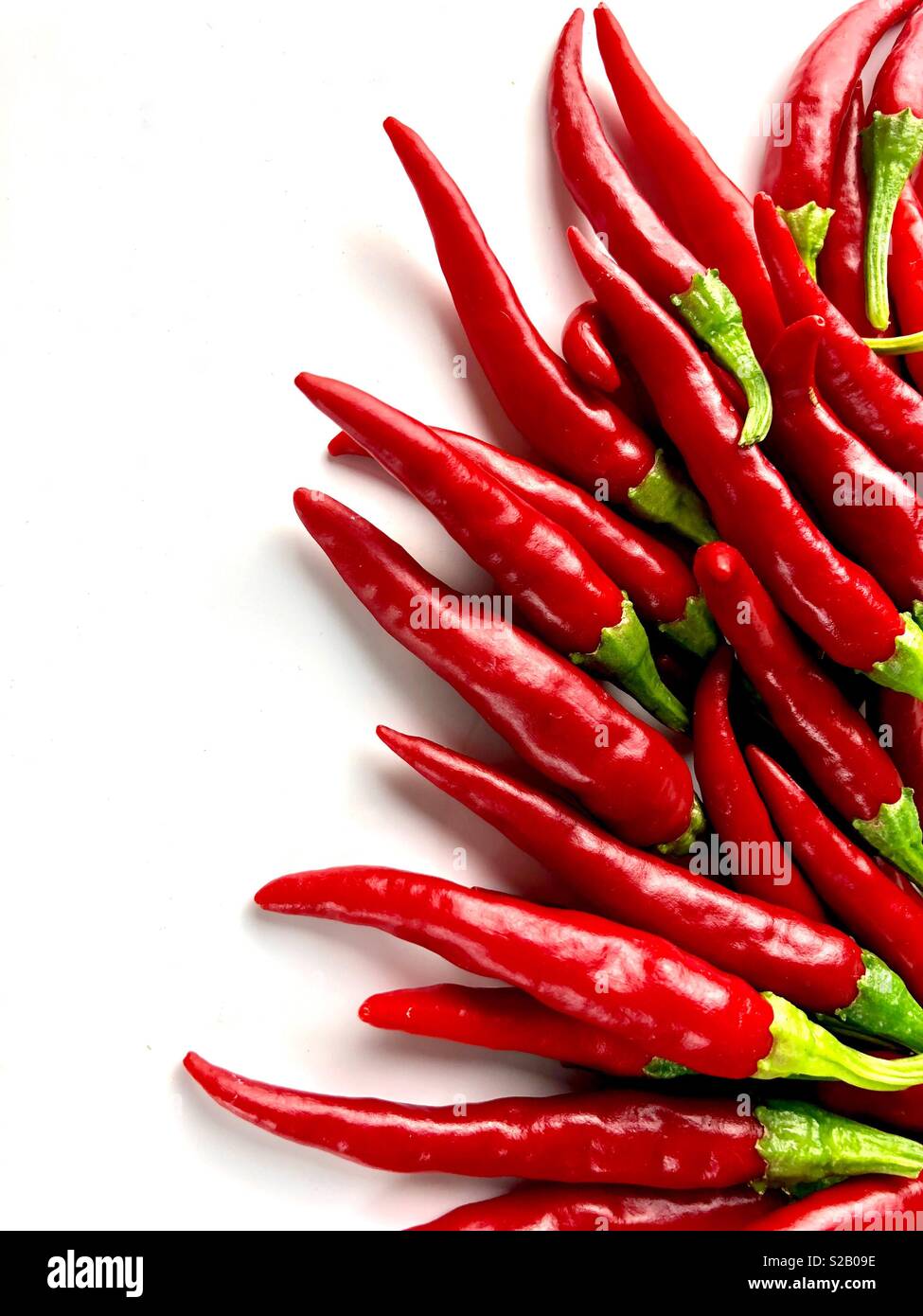 Cayenne peppers on a white background - Smartphone Captured Stock Image