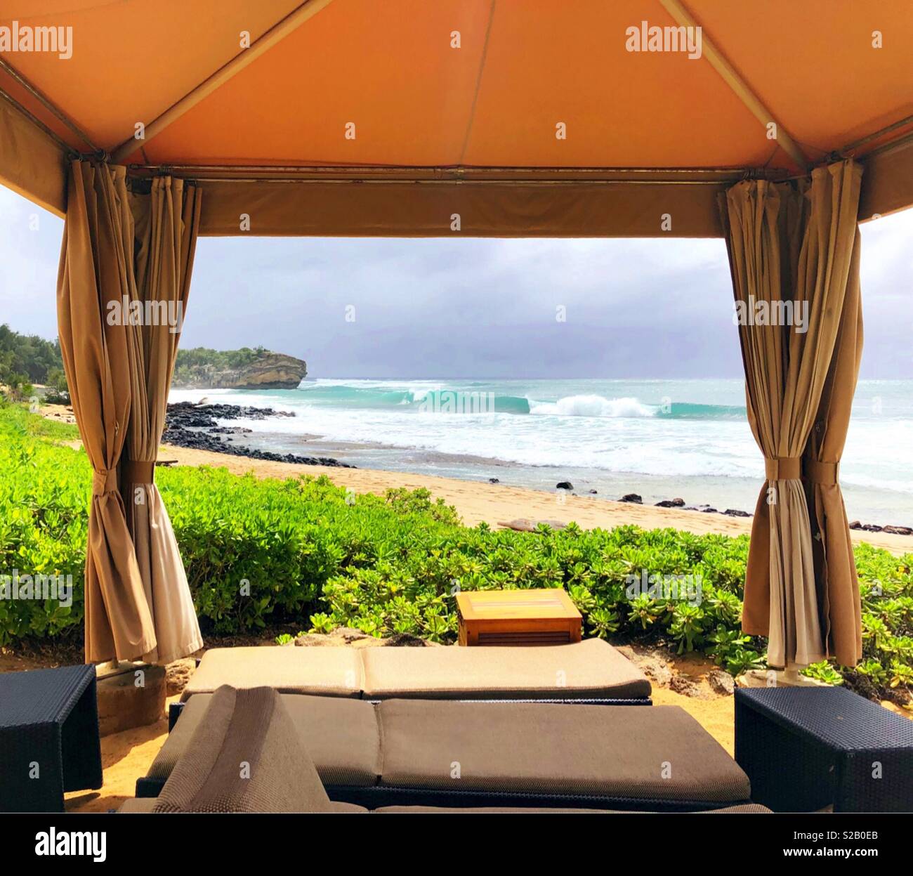 An inviting paradise beachside canopy beckons luxury under the tropical Hawaiian island sun in 