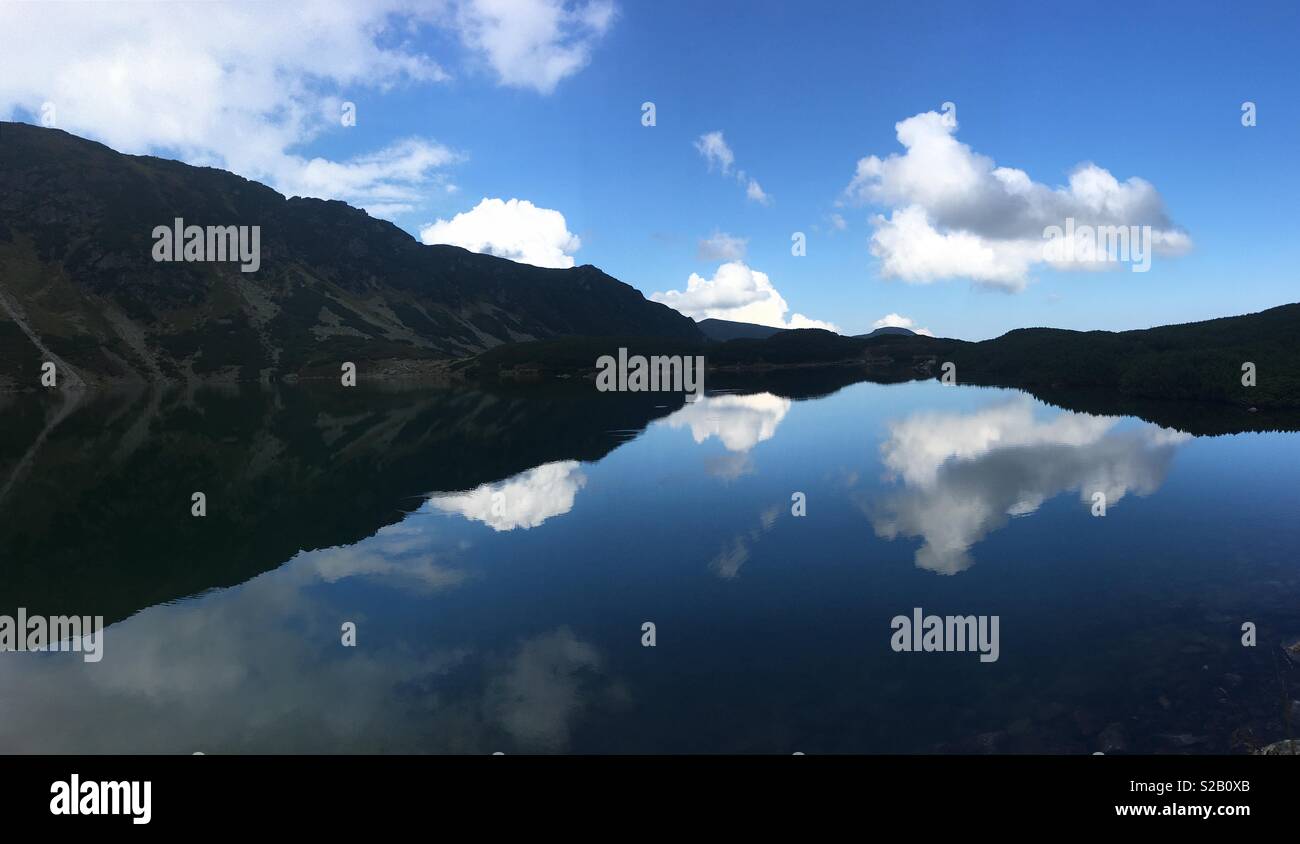 Sky reflection in Czarny Staw Gasiennicowy Lake, the Tatra mountains Stock Photo