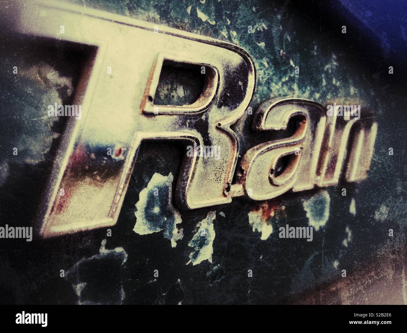 Grunge photo of the letters 'RAN' from the fender of a classic green 1970 Ford Ranger pickup - Smartphone Captured Stock Image