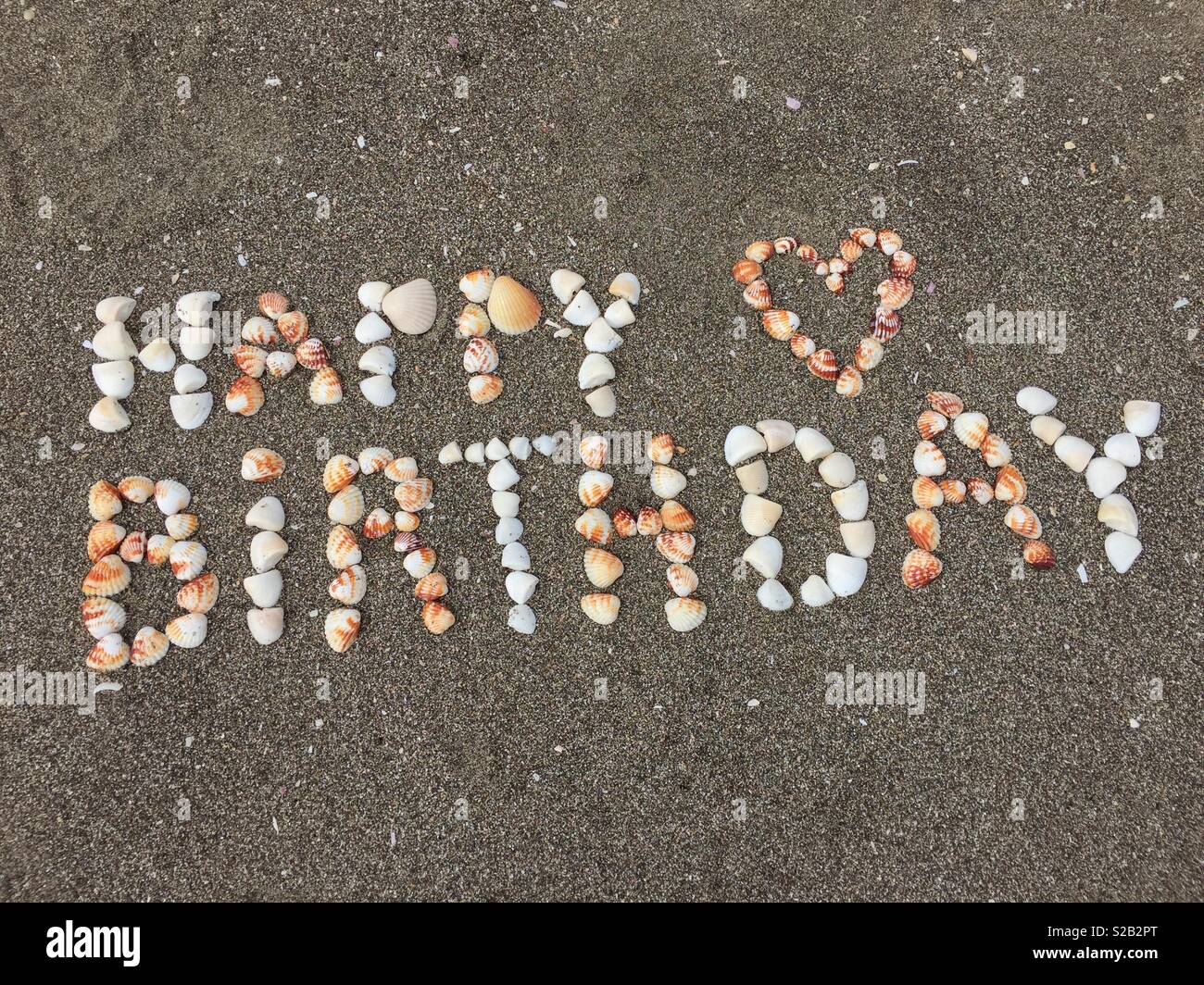 Happy Birthday with Sea Shells on the Beach Stock Photo - Alamy
