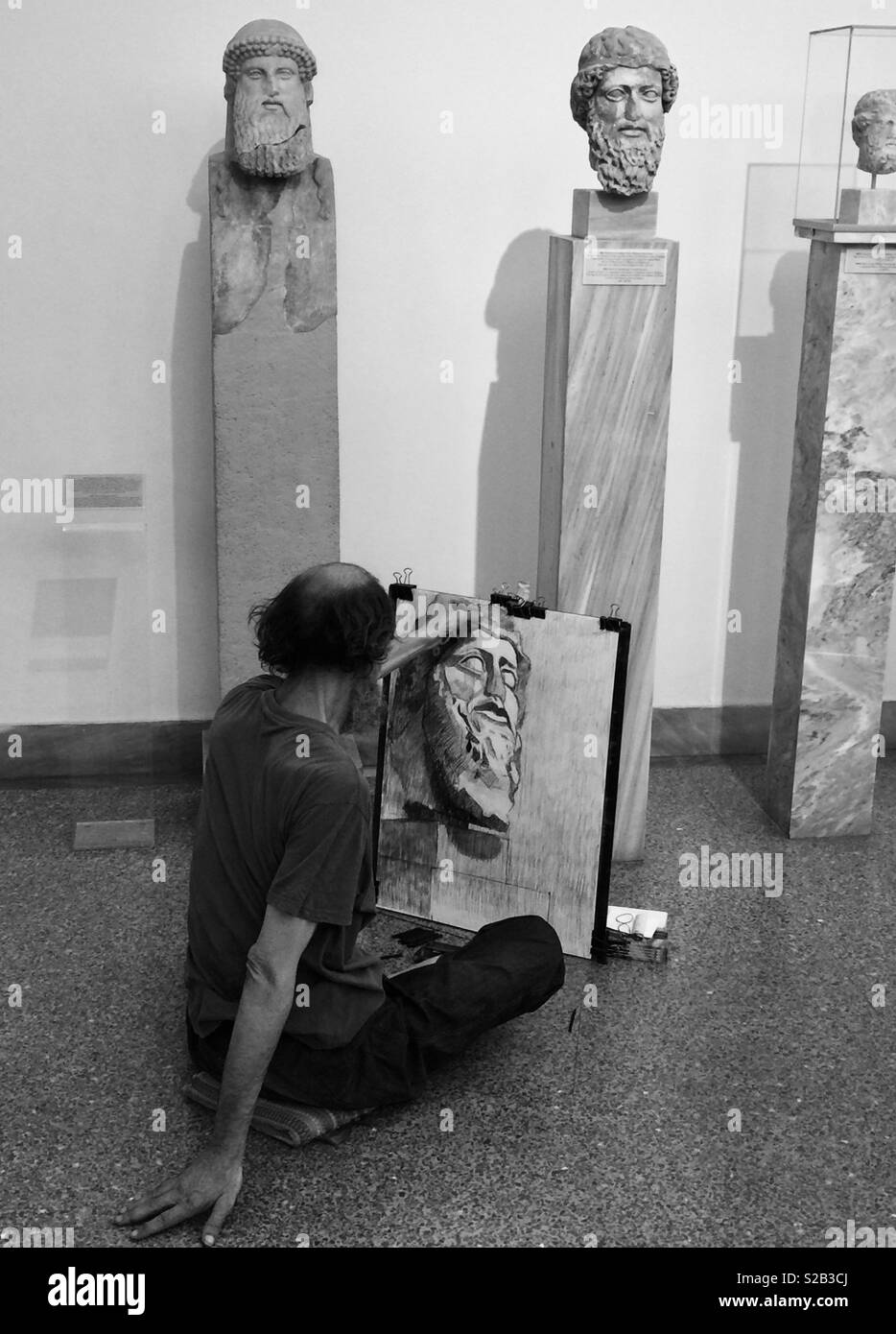 An amateur artist at work in the National Archaeological Museum in Athens, Greece Stock Photo