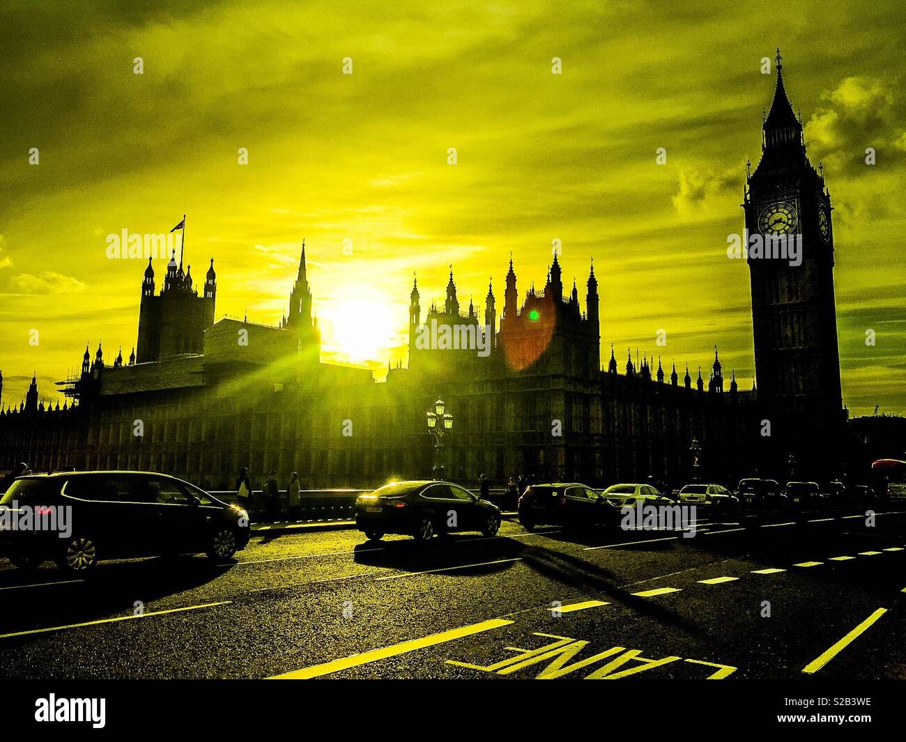 Houses of Parliament in central London in summer with yellow sky Stock Photo