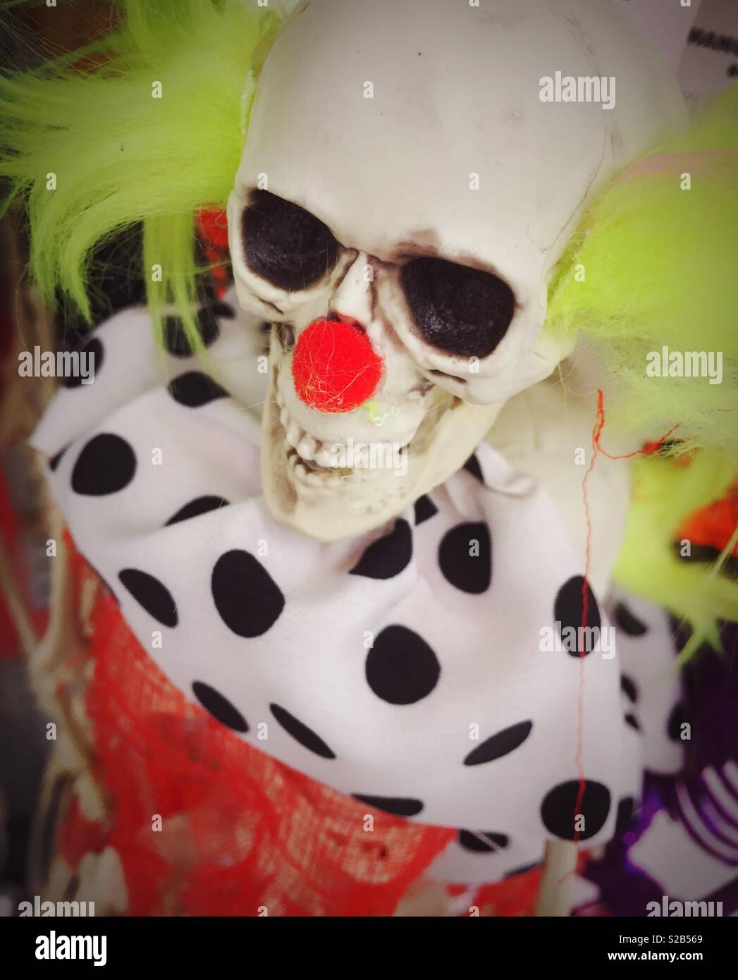 Halloween costume of skeleton mask and clown outfit, USA - Smartphone Captured Stock Image