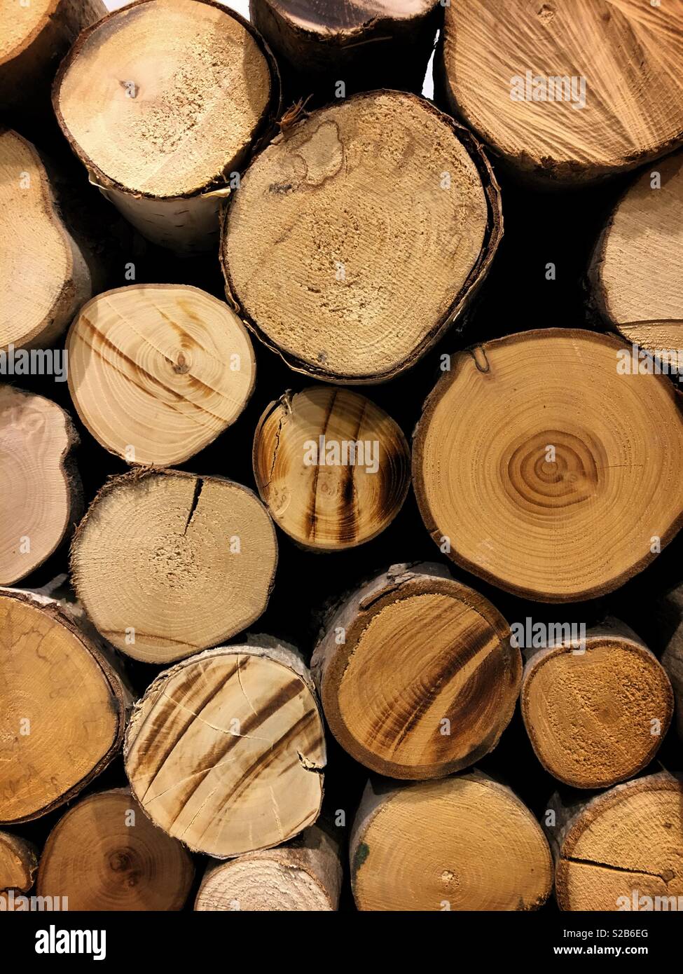 Pile Of Neatly Stacked Wooden Logs For The Fireplace Stock Photo