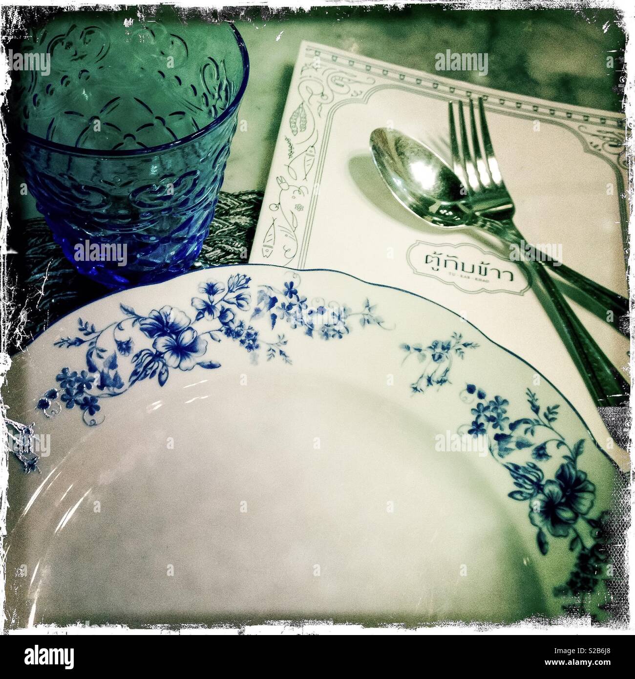 Place setting and menu, Tu Kab Khao Restaurant, Phuket Old Town, Phuket, Thailand - Smartphone Captured Stock Image