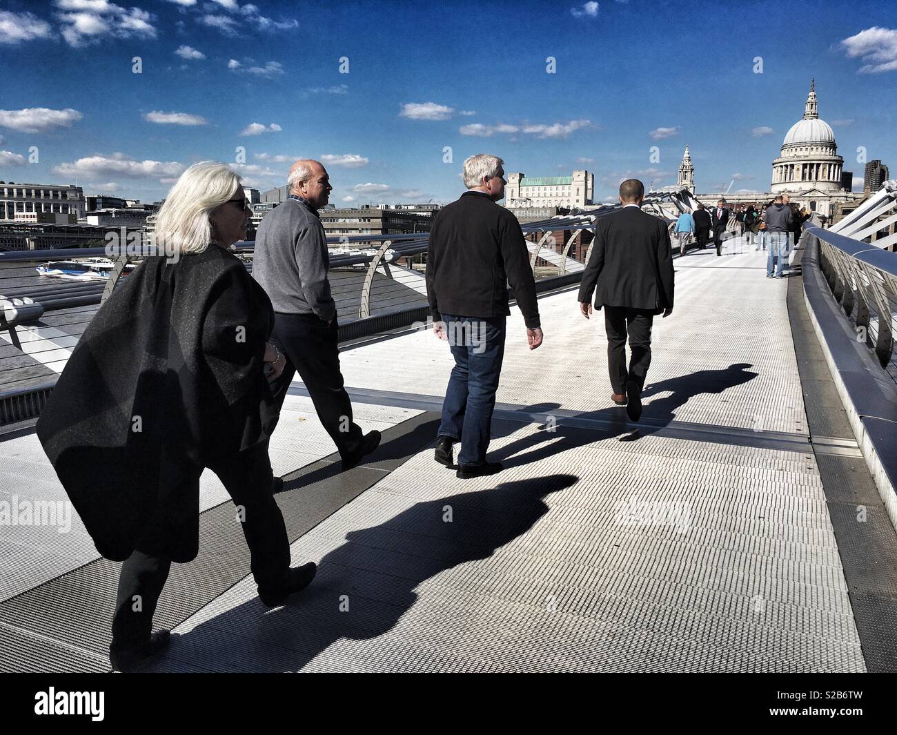 People walk across the Millennium bridge in London, England on September 25 2018 - Smartphone Captured Stock Image