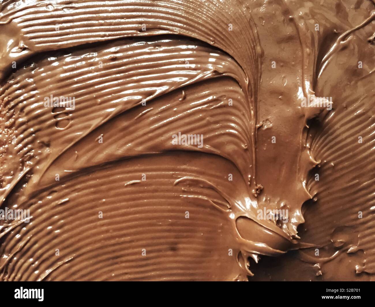 Chocolate cream spread on a slice of bread - Smartphone Captured Stock Image
