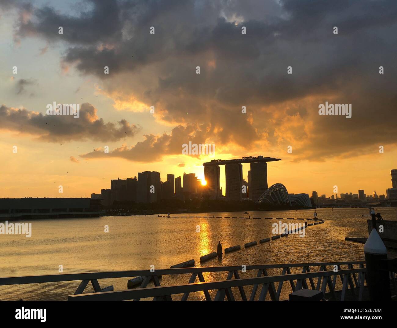Sunsets over Singapore buildings Stock Photo