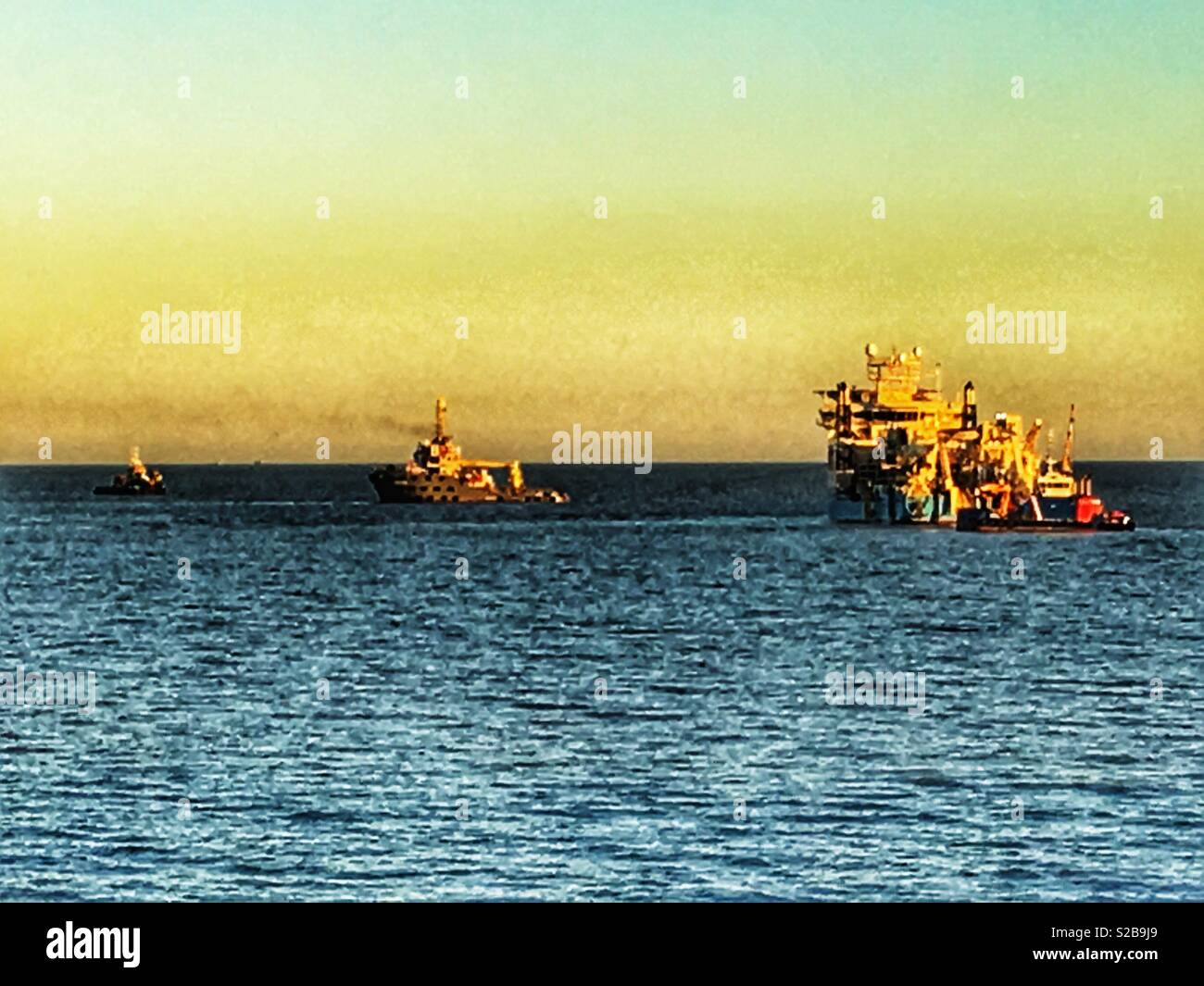 Maersk Connector, laying underwater electric cables to a offshore wind farm called East Anglia One in the North Sea, Bawdsey, Suffolk, UK. - Smartphone Captured Stock Image