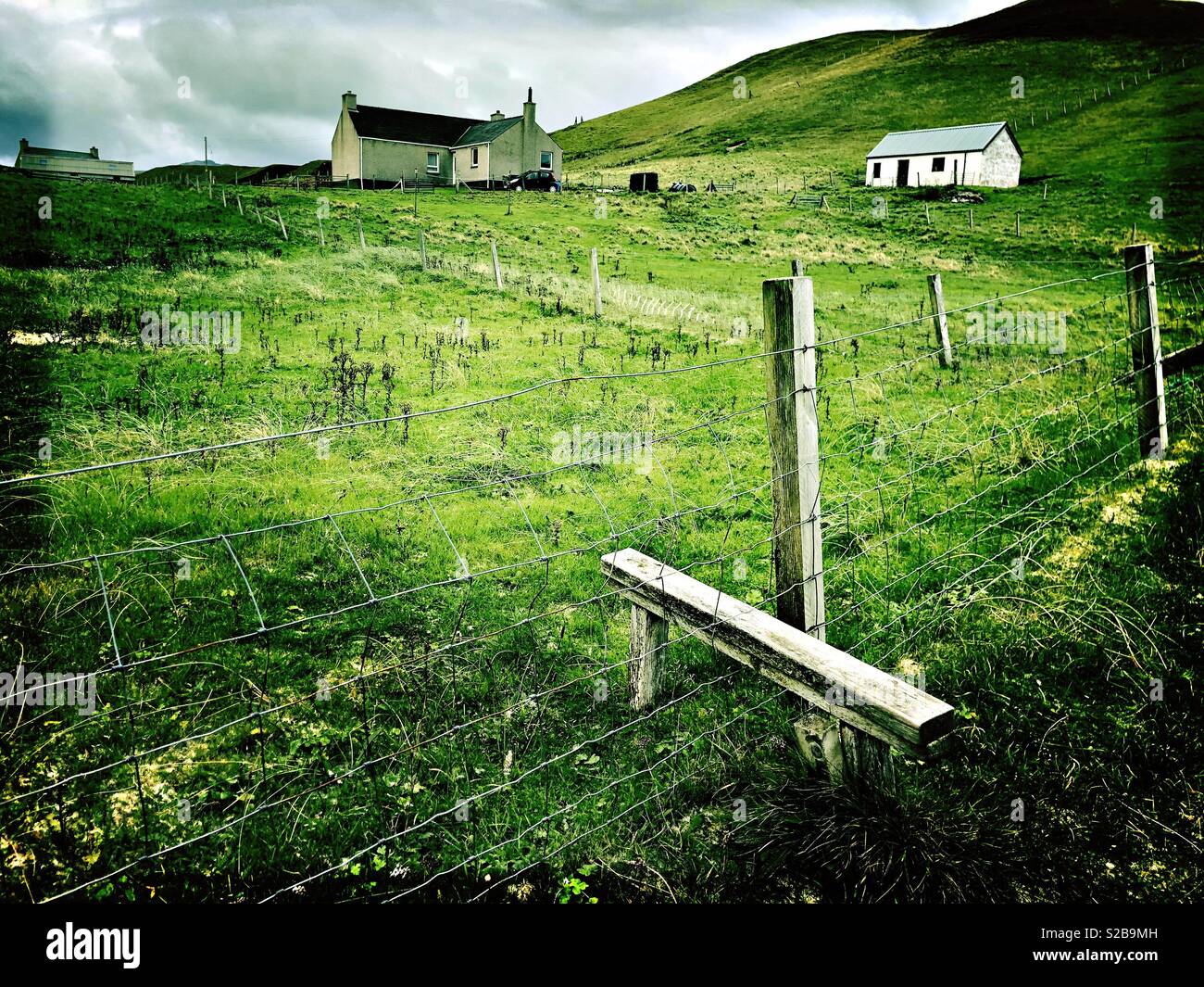 Crofthouses and Barn, Fence and Stile in Isle of Lewis, Western Isles, Scotland in September - Smartphone Captured Stock Image