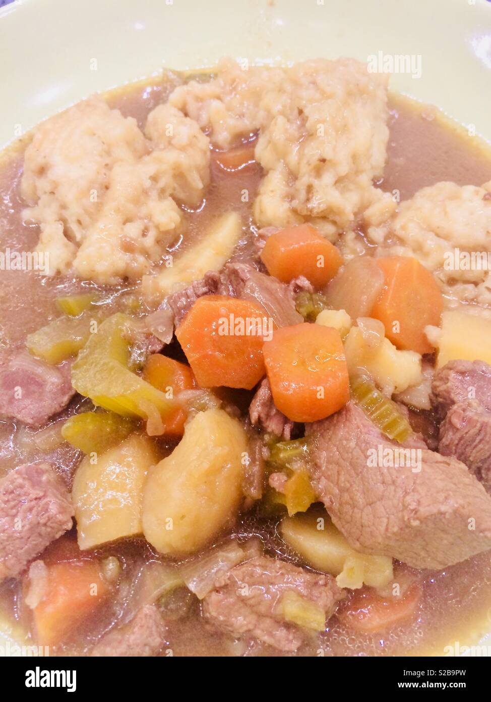 Beef stew and dumplings with carrots and potatoes Stock Photo Alamy