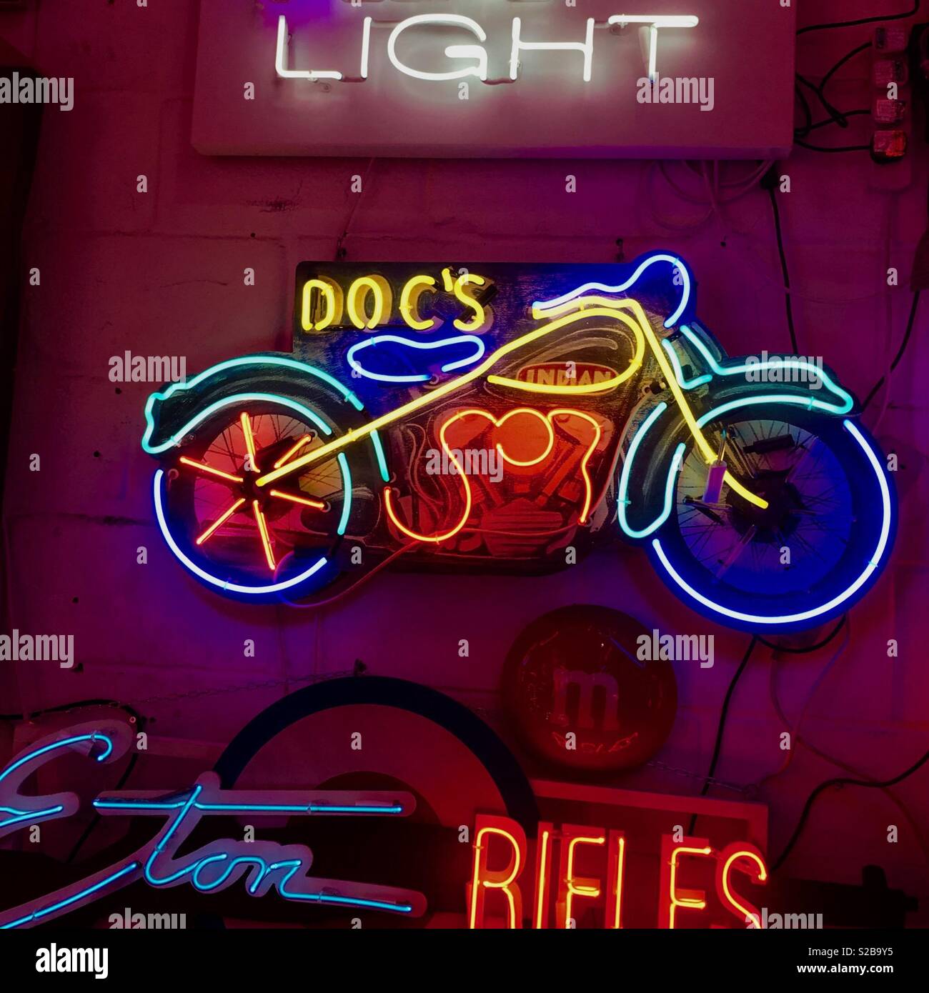 Neon Doc’s motorbike sign, God’s own junkyard, Walthamstow, London Stock Photo