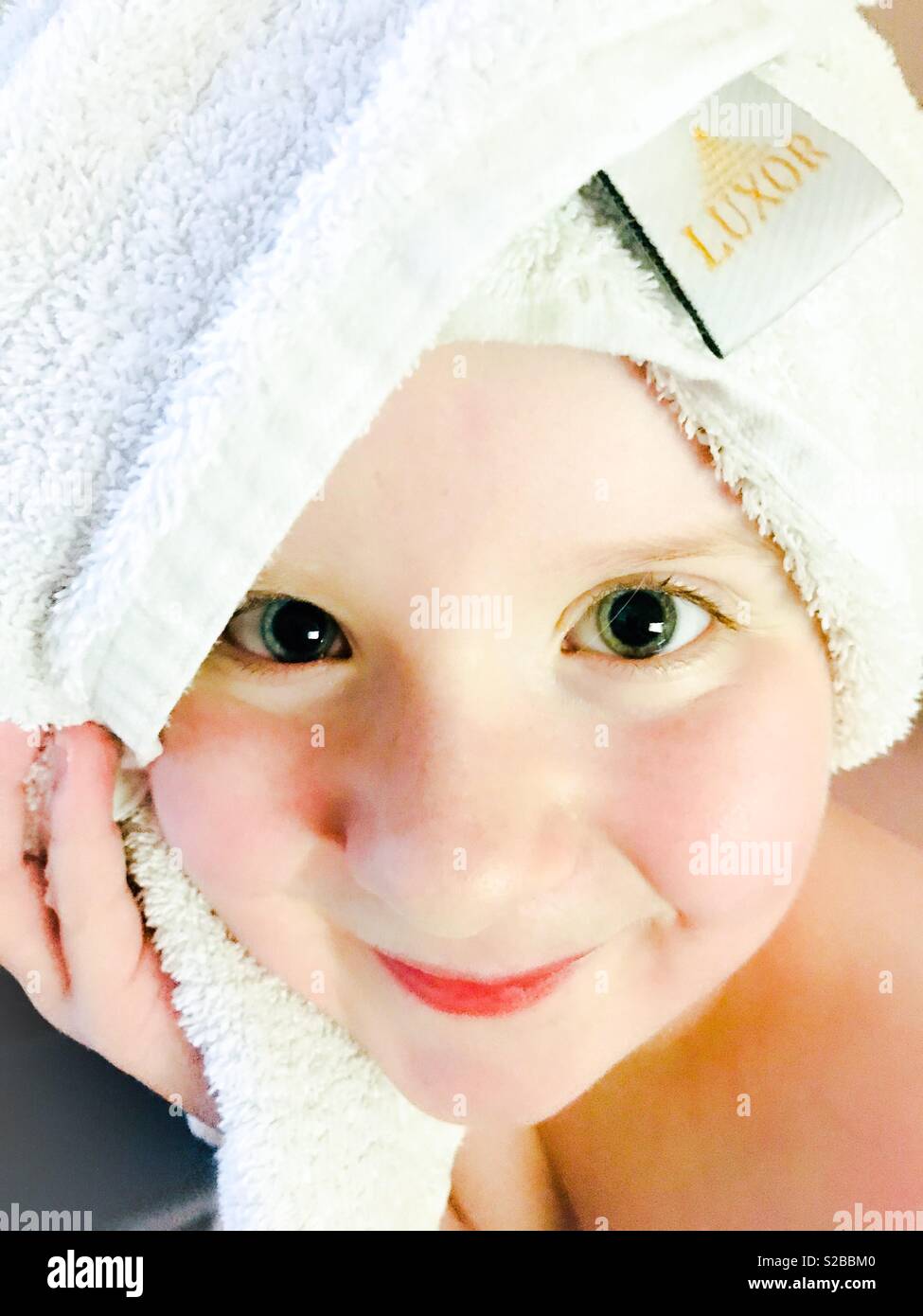 Young girl wearing a towel on her head Stock Photo