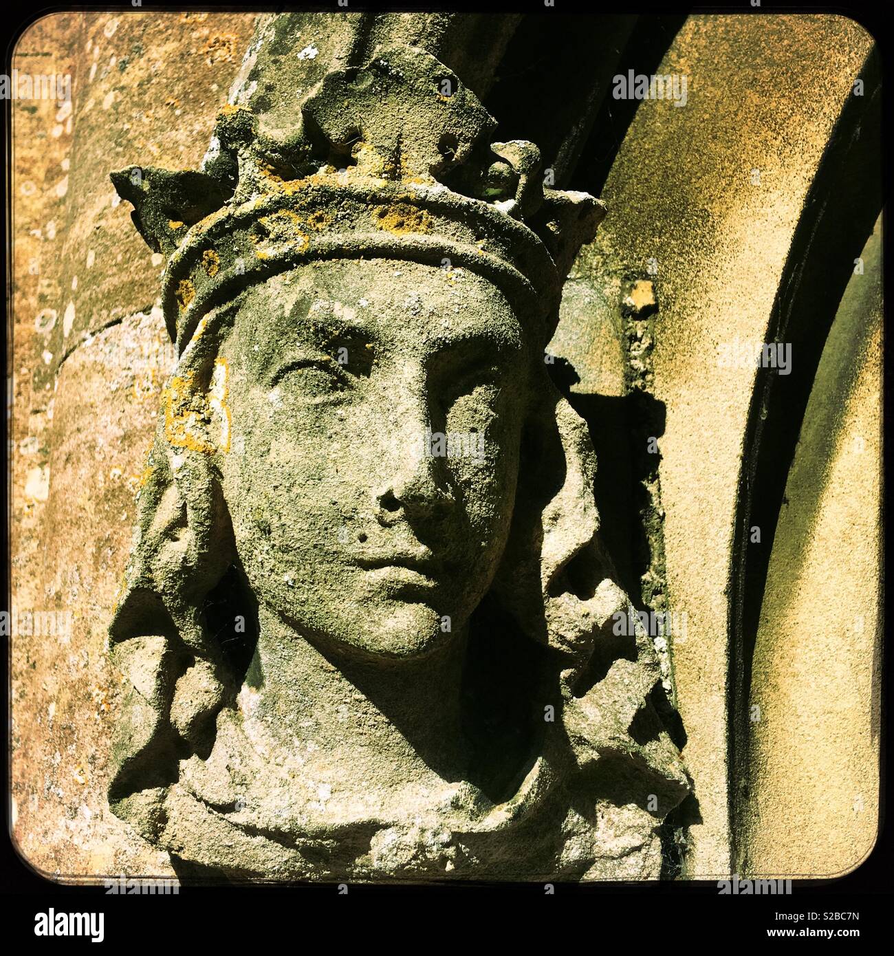 Carved stone head at St Peter’s church, North Rauceby, Lincolnshire, UK. Stock Photo