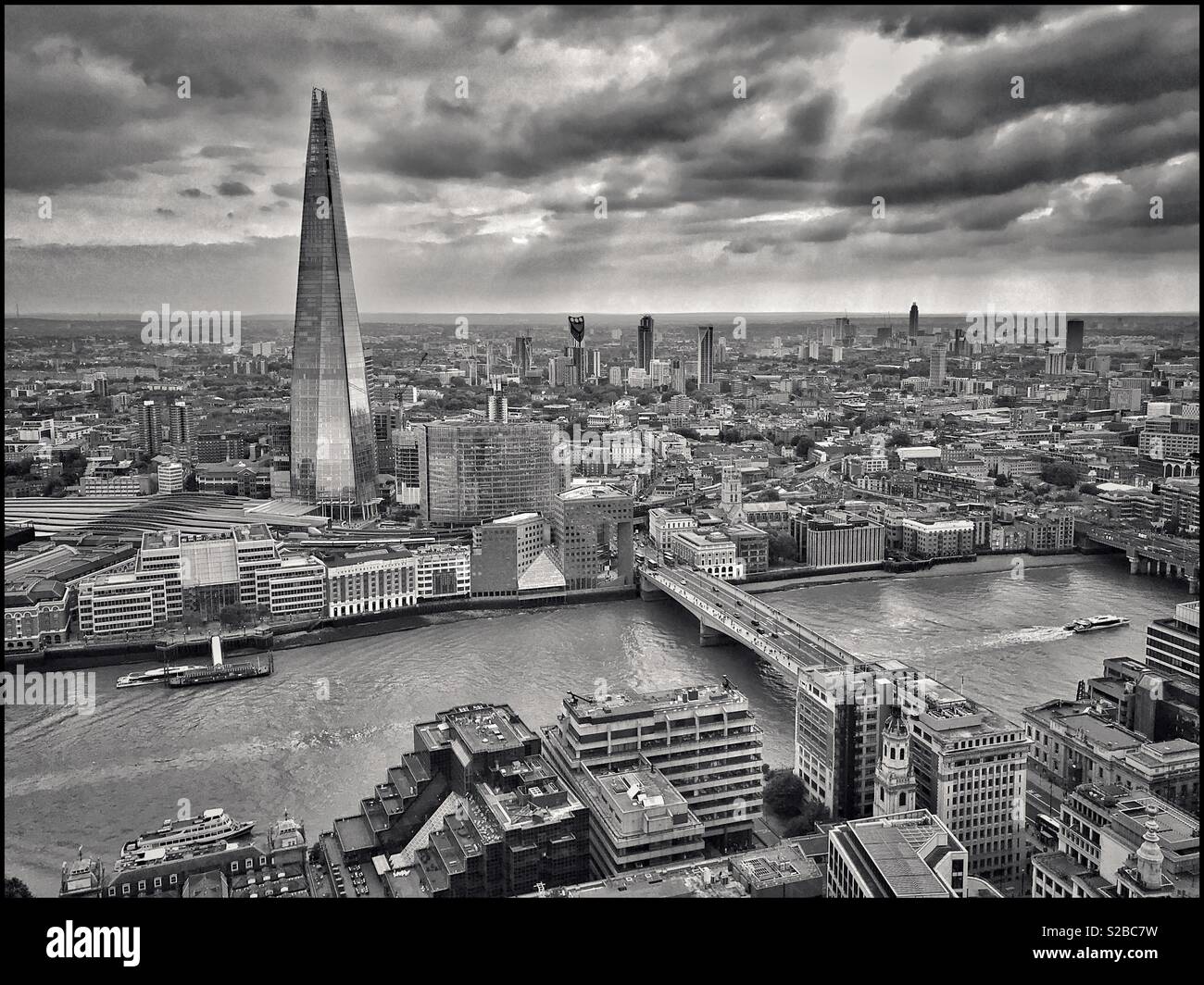 An aerial view of The River Thames at London Bridge, showing The Shard - the EU’s tallest building. This skyscraper is 309.7m high, and has 96 floors - 72 are habitable. Photo Credit © COLIN HOSKINS. - Smartphone Captured Stock Image