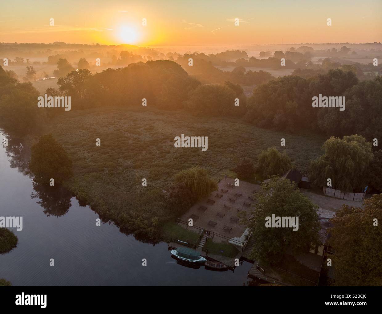 The boathouse at Dedham on the river stour in early morning mist in autumn - Smartphone Captured Stock Image