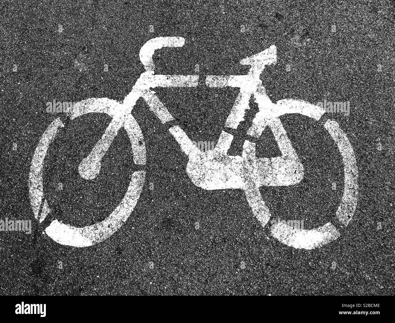 A painted sign on the tarmac/asphalt in a large European city - this area is designated for bicycles. This is a cycle lane. An image to promote environmental awareness. Photo Credit - © COLIN HOSKINS. - Smartphone Captured Stock Image