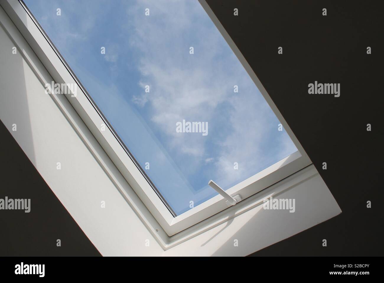 Low angle view of a window with a clear blue sky Stock Photo