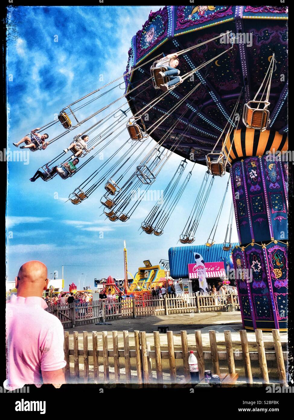 Swings at the fair Stock Photo Alamy