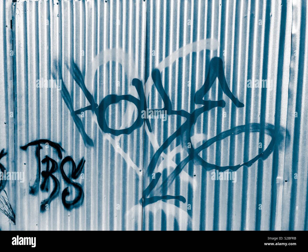 Graffiti on corrugated tin Voulagmeni Athens fry Stock Photo