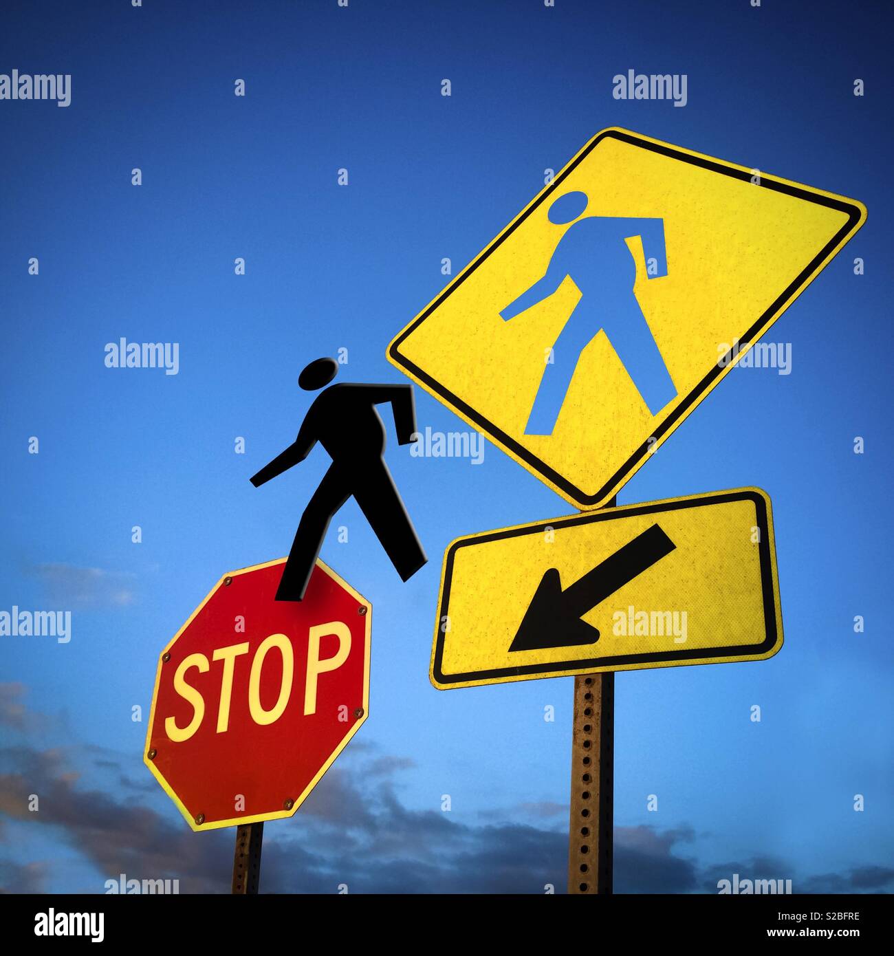 Pedestrian sign hole and pedestrian figure goung to an Stop Sign - Smartphone Captured Stock Image