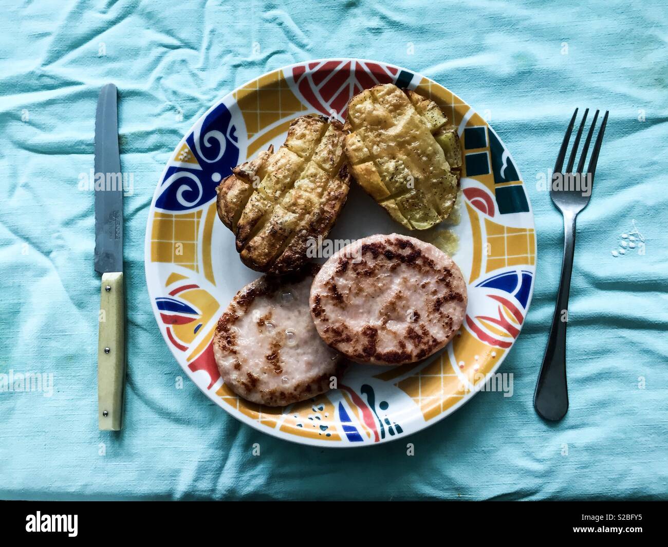 A dish of potatoes and burguers - Smartphone Captured Stock Image