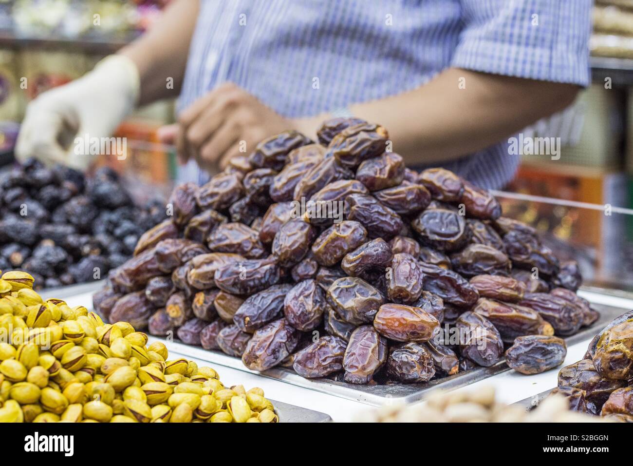 Dried fruit shop vendor in dubai spice souk Stock Photo Alamy