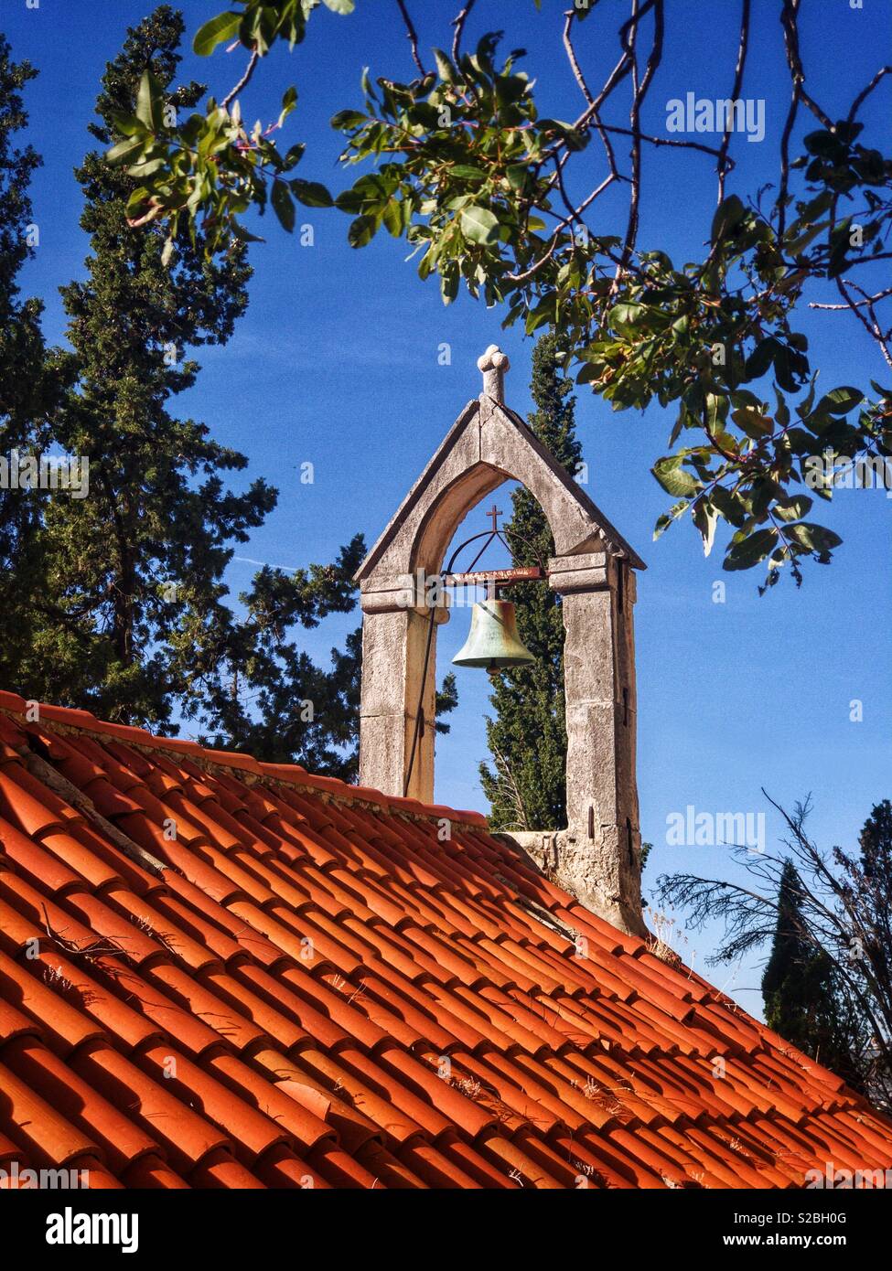Church roof with the bell Stock Photo