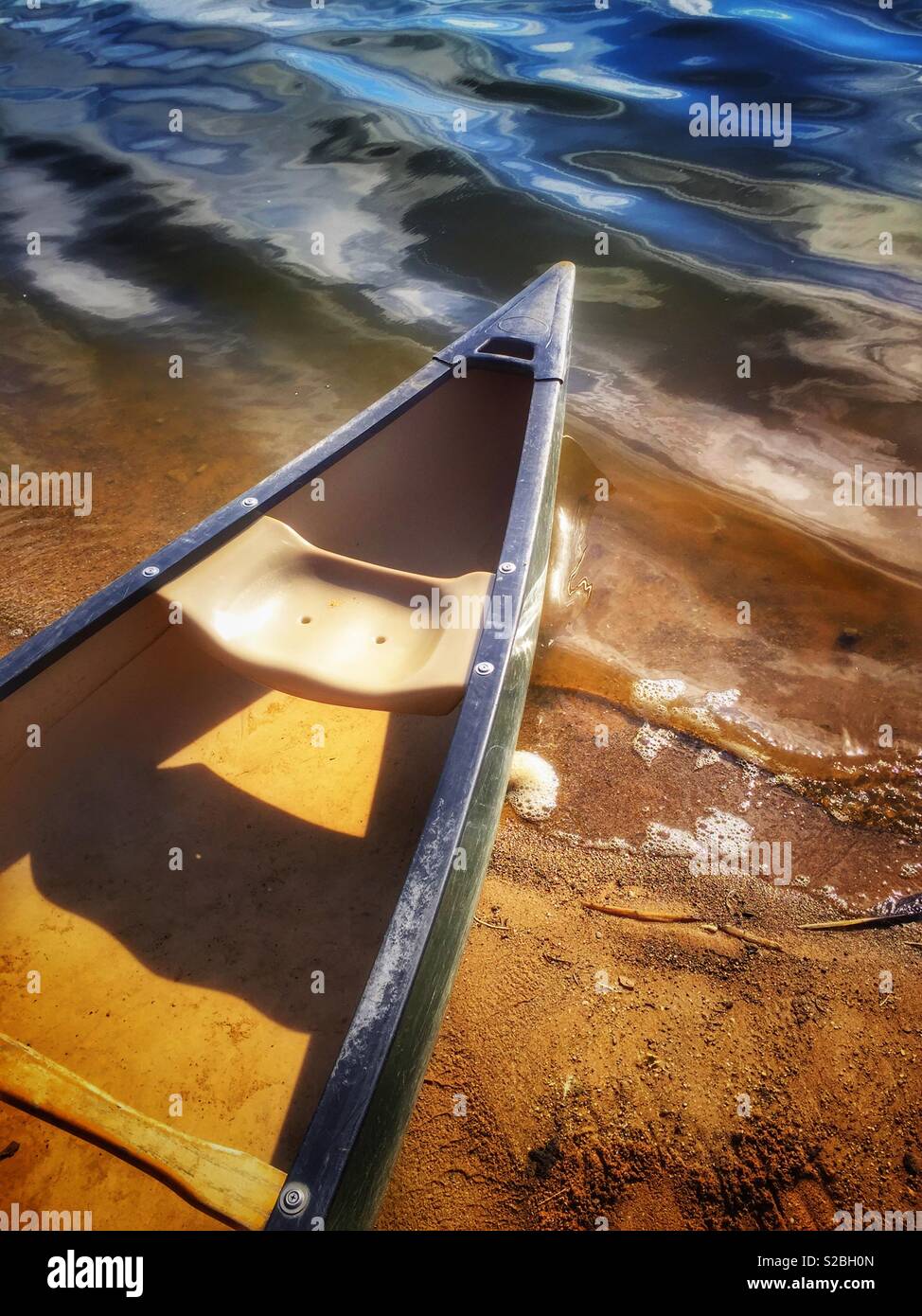 Canoe on lake shore - Smartphone Captured Stock Image