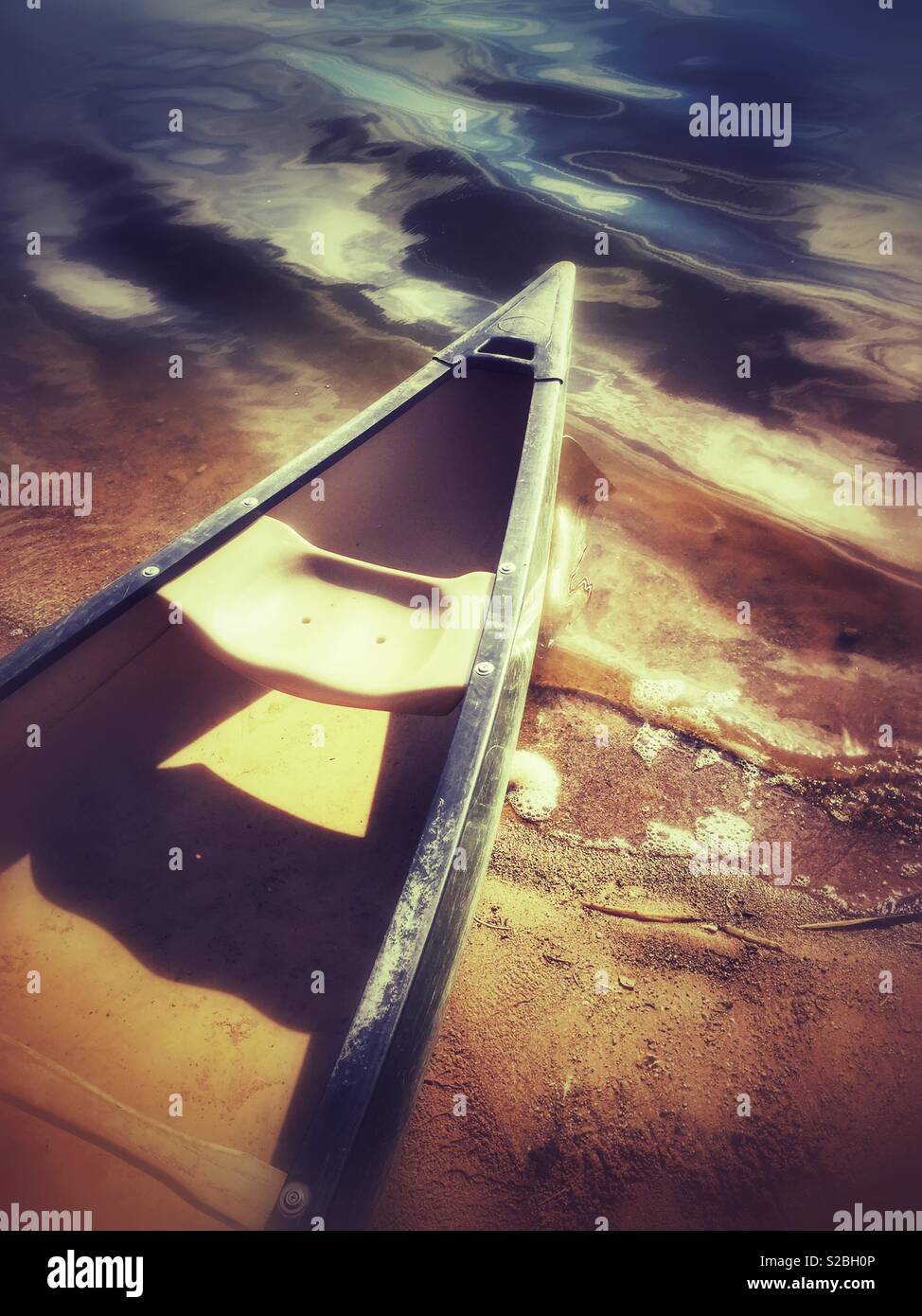 Canoe on lake shore - Smartphone Captured Stock Image