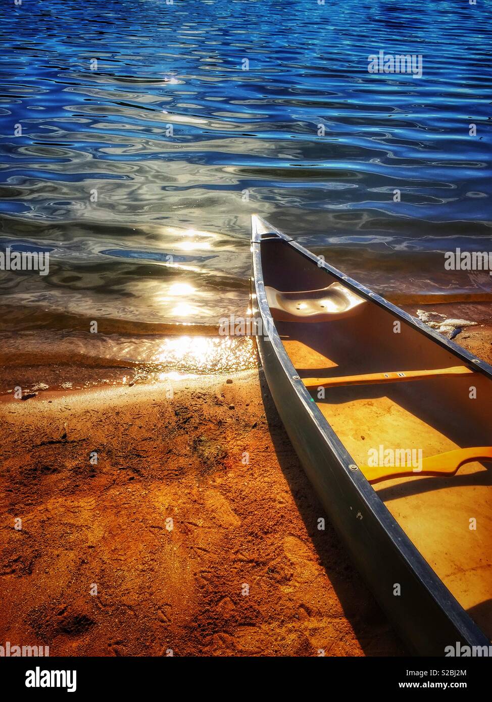Canoe on lake shore - Smartphone Captured Stock Image