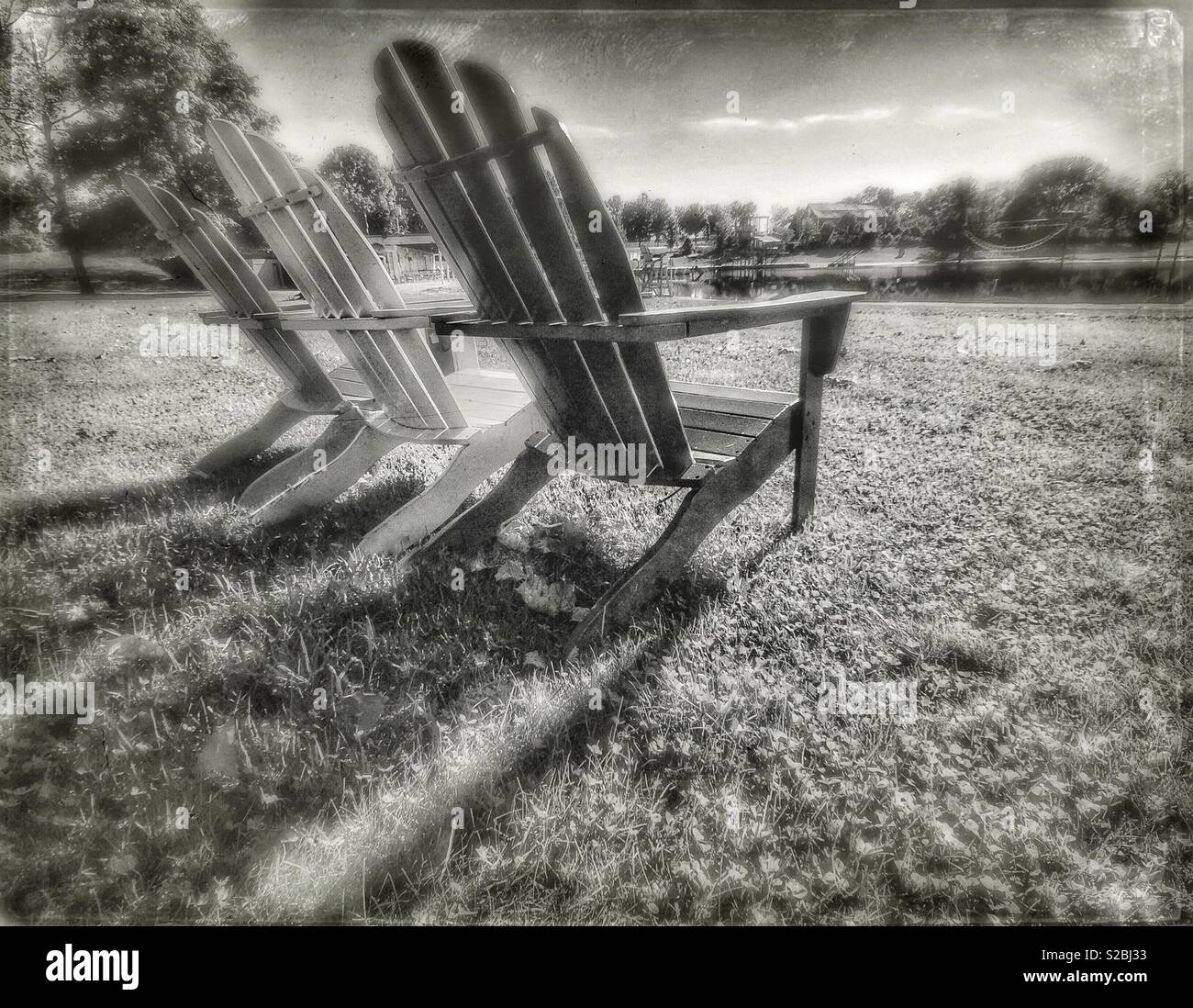 Adirondack chairs on a lake - Smartphone Captured Stock Image