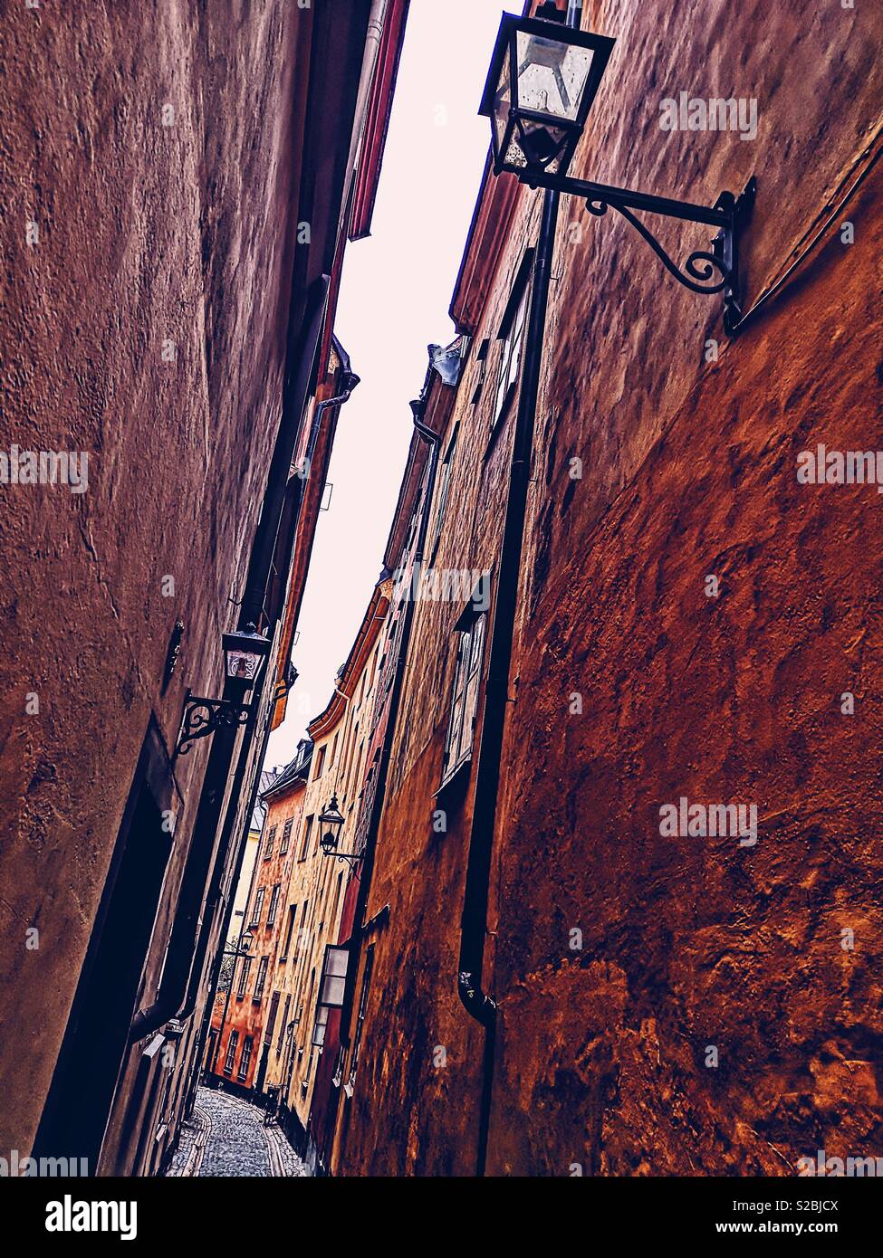 Narrow painted alleyway, Gamla Stan, Stockholm’s old town, stockholm, Sweden - Smartphone Captured Stock Image