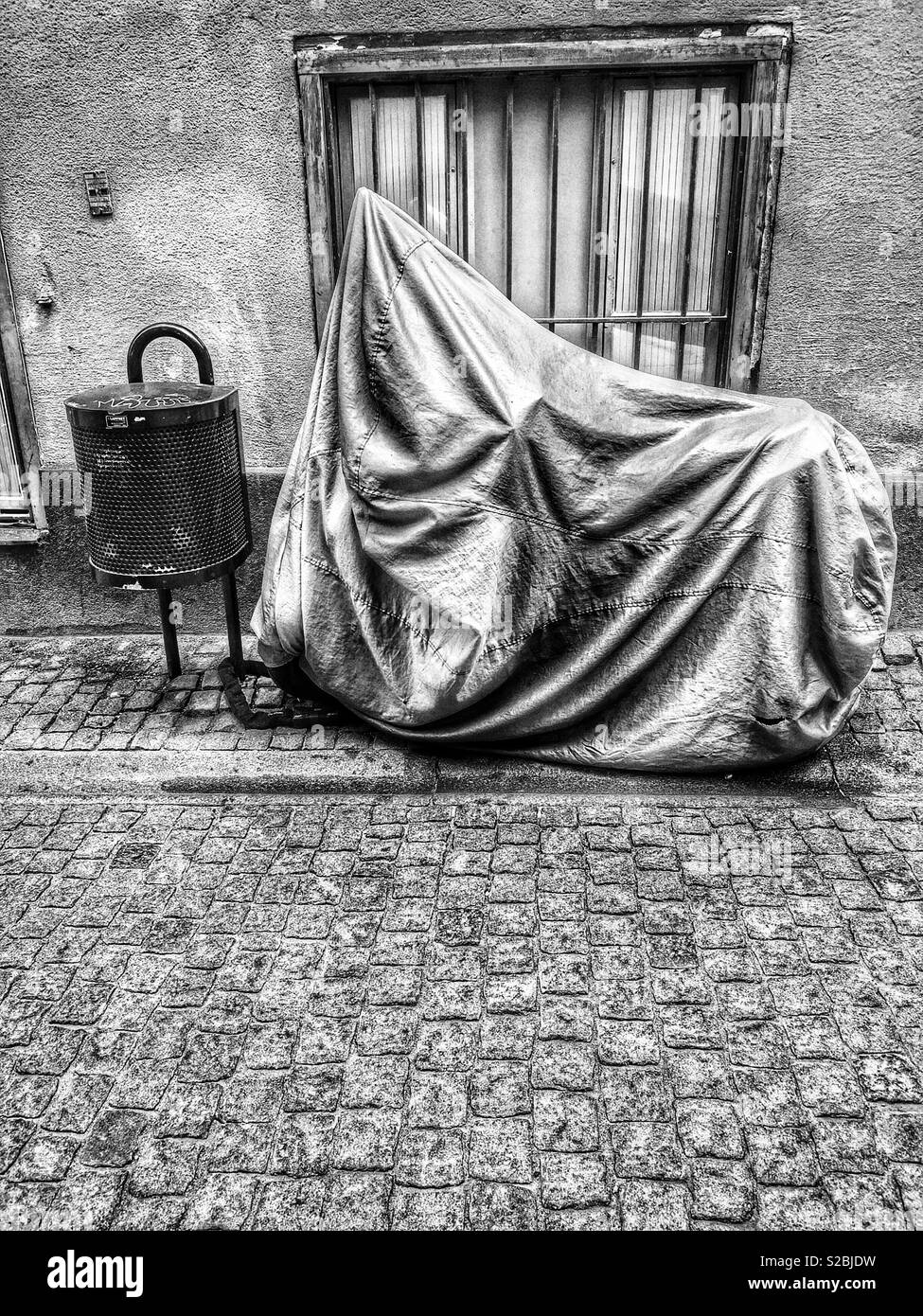 Motorcycle rain cover for protection, Stockholm, Sweden - Smartphone Captured Stock Image