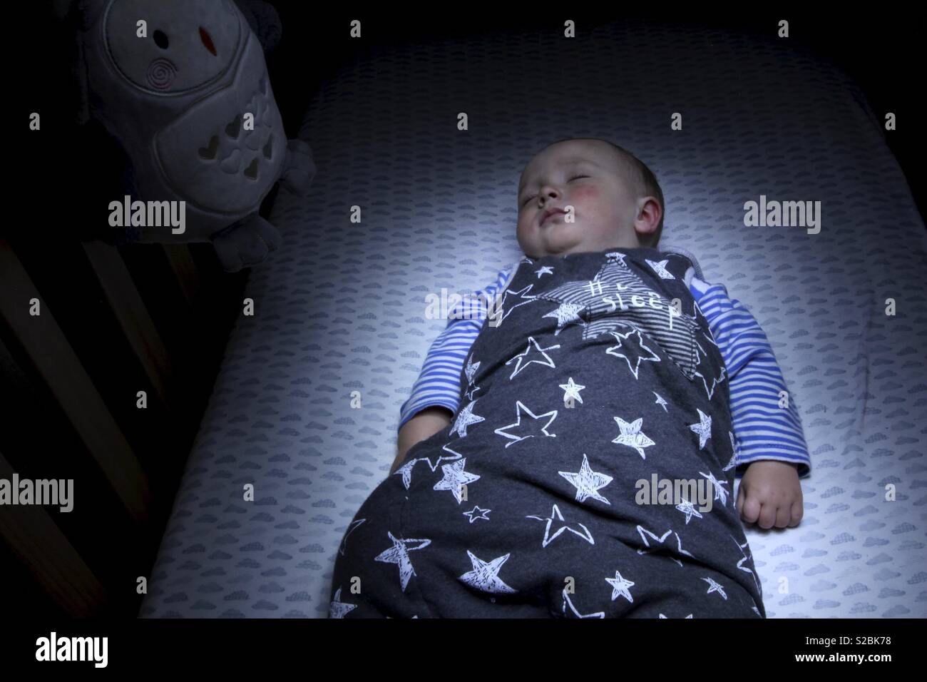 Sleeping Baby in cot Stock Photo Alamy