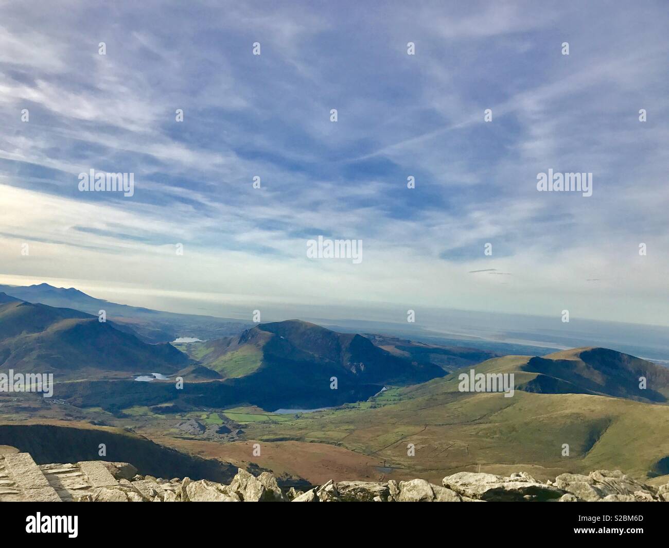 Looking down on the world from the summit of Snowdon Stock Photo