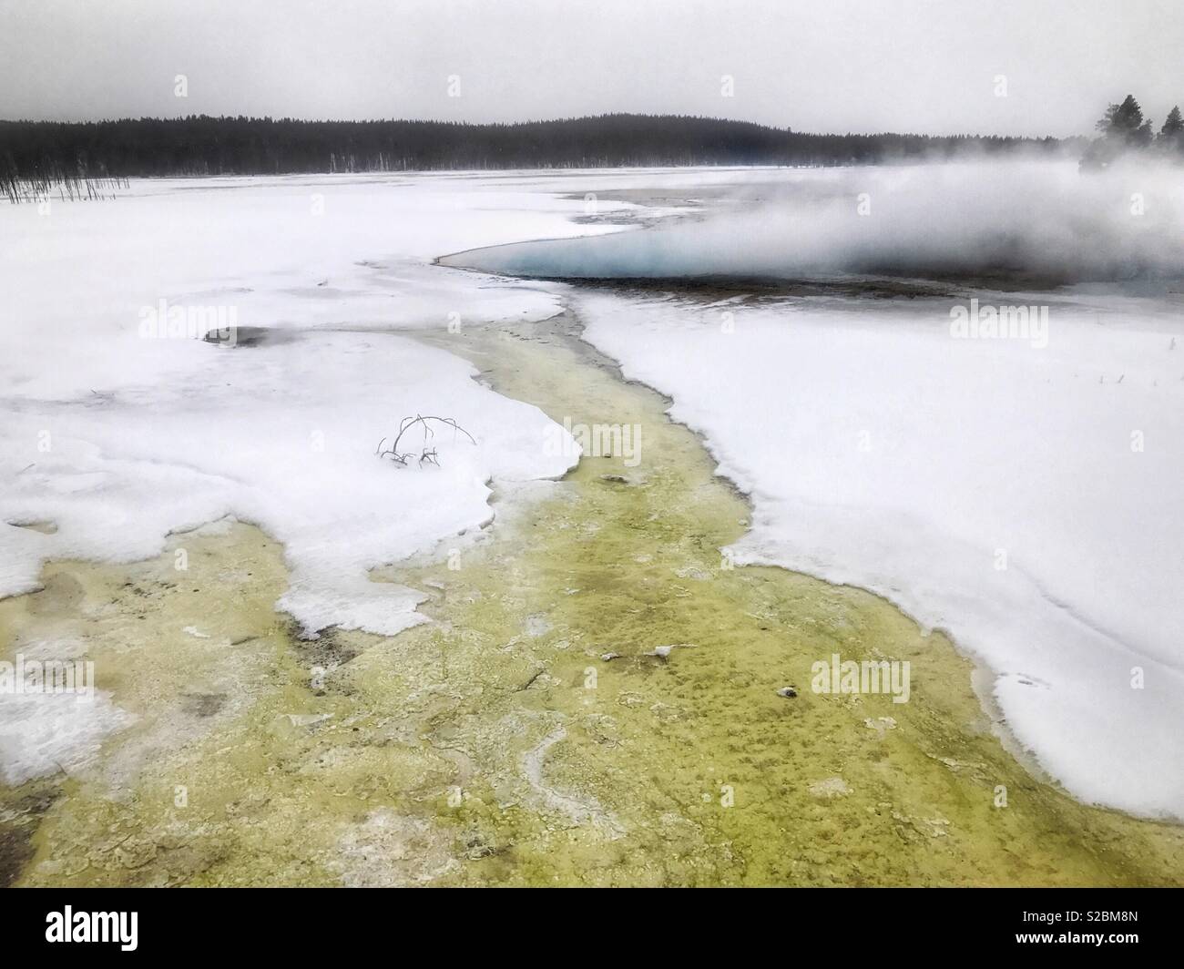 Winter scene of thermal feature and landscape at Lower Geyser Basin in Yellowstone National Park, USA - Smartphone Captured Stock Image