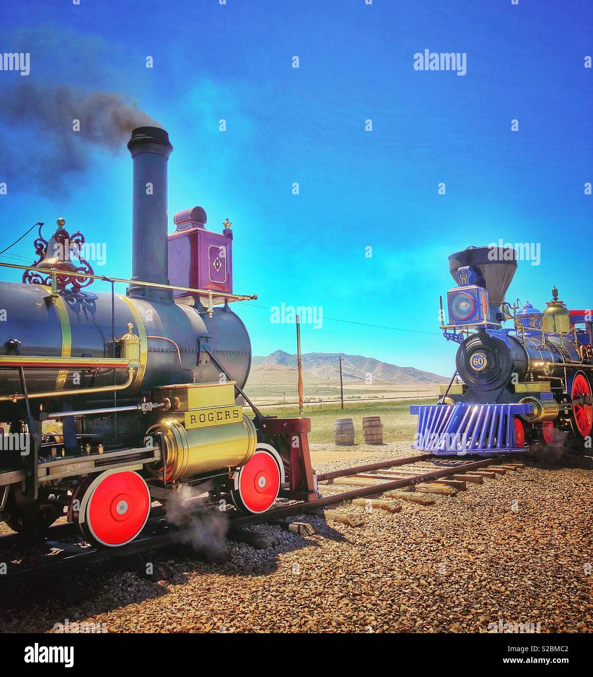 Two vintage steam train engines meet atGolden Spike Utah Stock Photo