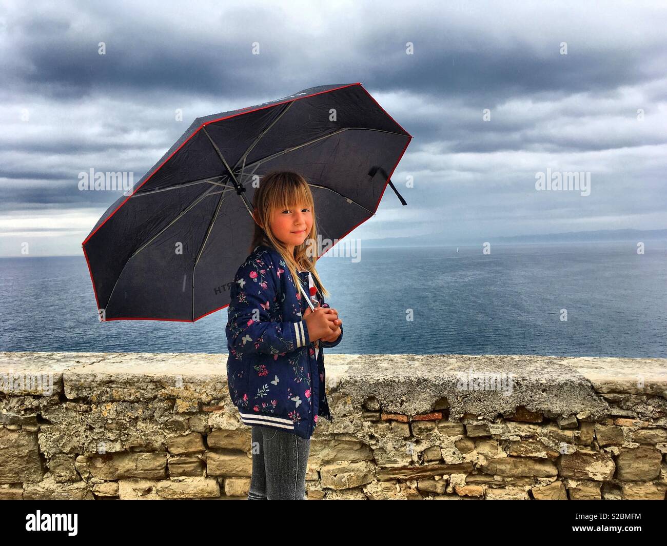 Girl with umbrella Stock Photo - Alamy