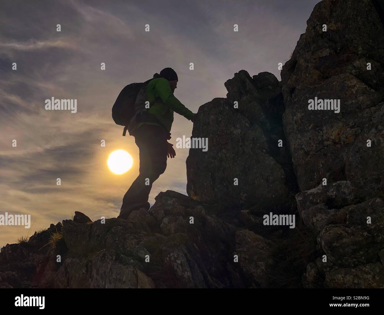 Silhouette of a hiker with a backpack - Snowdonia National Park, Wales, UK - Smartphone Captured Stock Image