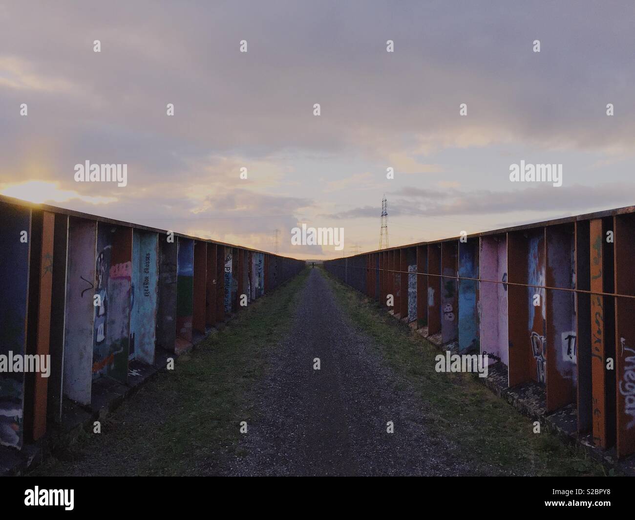 Commissioned art on bridge crossing of Fledborough Viaduct Sustrans route at dusk in autumn, Nottinghamshire, England, UK - Smartphone Captured Stock Image