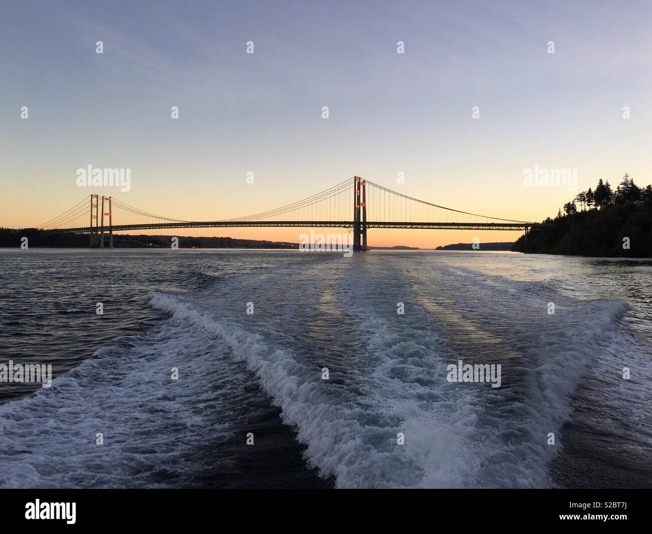 Cruising away from the Tacoma Narrows Bridge in Tacoma WA Stock Photo