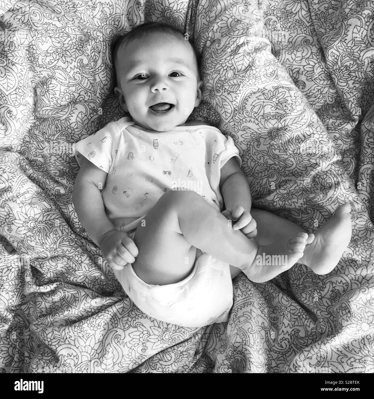 Happy baby on bed Stock Photo Alamy